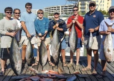 Bachelor Party Showing Their Tuna Catches